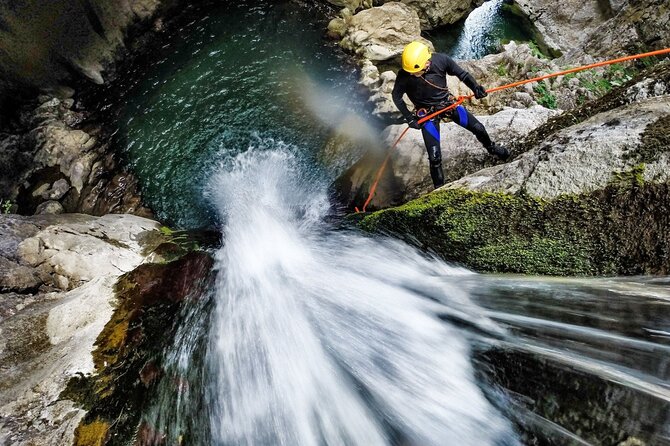 5Hrs Advanced Canyoning (50m) 12 Rappels (Pickup, Lunch & GoPro) - Entering the vertical world: how the 50-meter rappel shapes the day