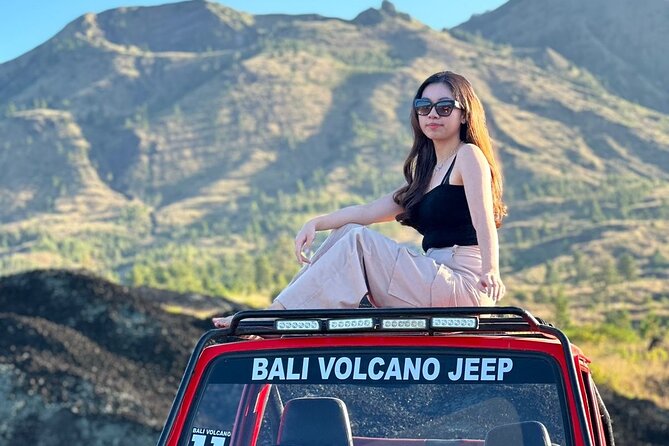 Bali: Mount Batur Jeep Sunrise & Hot Springs - All Inclusive - Black lava and a floating temple photo stop