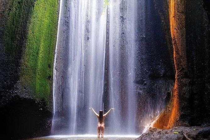 Discover the best waterfalls in Ubud and rice terraces tour - Kanto Lampo Waterfall: tumbling cascades and the under-river photo angle