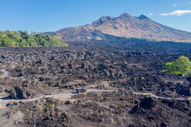 Kintamani Black Lava Sunrise Jeep Adventure with Temple in Bali - Riding Batur’s black lava in rugged jeeps