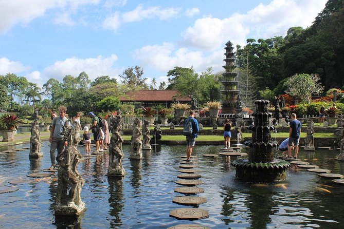 See The Gate of Heaven at Lempuyang Temple in Bali - Tirta Gangga Water Palace: royal-era water gardens and calm photo time