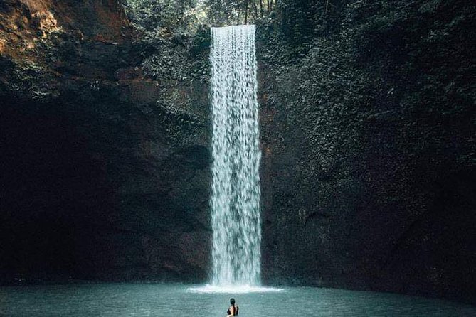 Top Bali Waterfalls: Suwat, Kanto Lampoe, Tibumana Waterfall - Suwat Waterfall: a turquoise pool plus cave access and cliff-jump energy